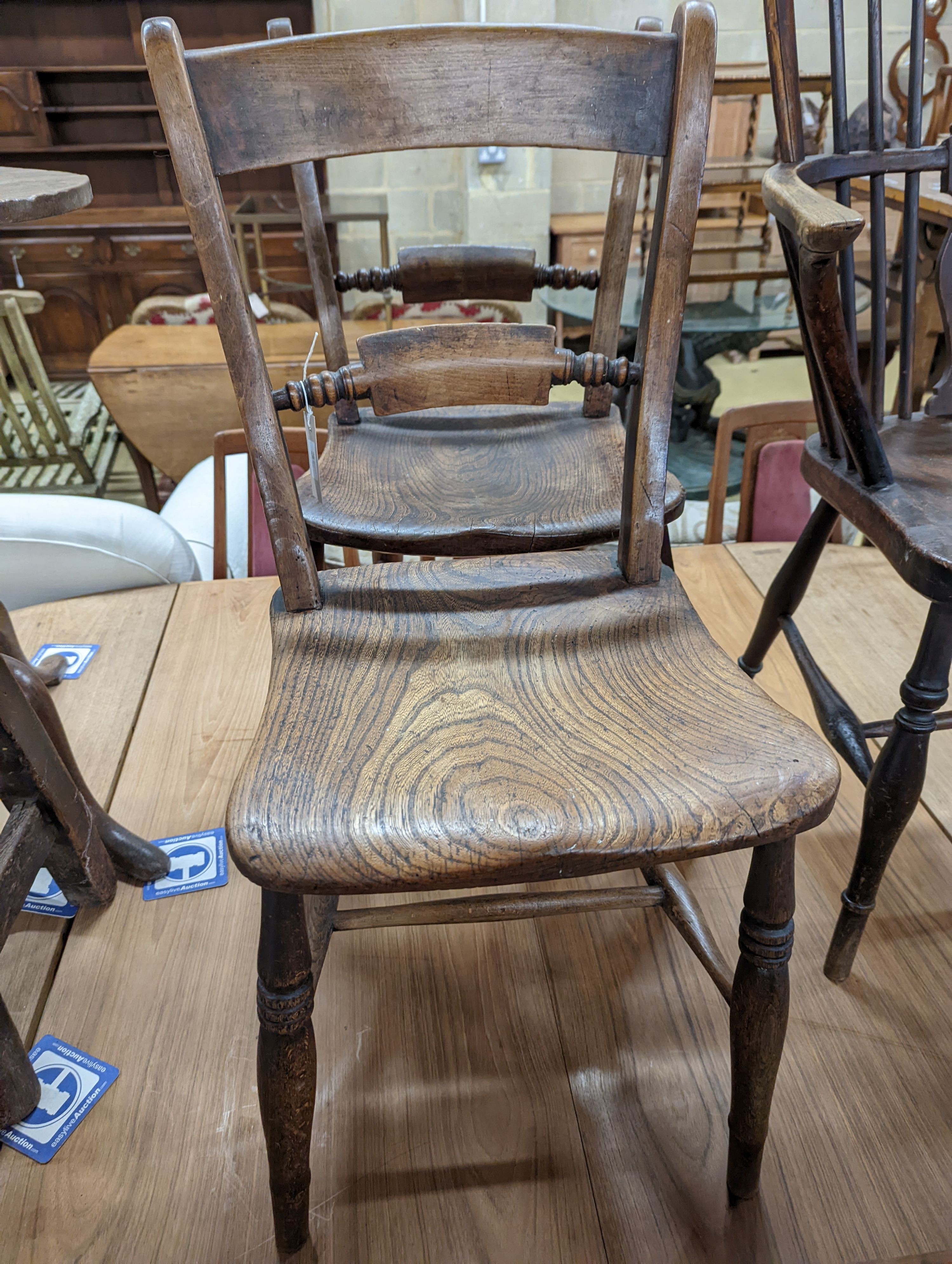 A pair of Victorian Windsor elm and beech kitchen chairs. H-83cm.